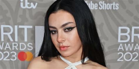 Charli XCX Frees the Nipple In a Nude Lingerie Dress For。